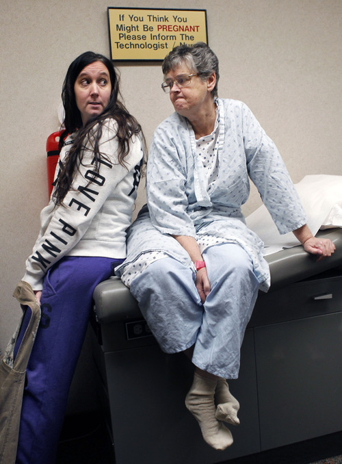 Al Hartmann  |  The Salt Lake Tribune
Bonnie Moncur keeps a stiff upper lip as she waits with her daughter Dana Harvey in pre-op at the U. Hospital Tuesday November 20. She is the seventh patient at the U. to benefit from new technology for repairing brain aneurysms.