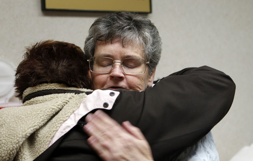 Al Hartmann  |  The Salt Lake Tribune
Bonnie Moncur gets a hug from a relative as she waits in the "ready room" at the U. Hospital on Tuesday Nov. 20. The 61-year-old Davis County woman is the seventh patient at the U. to benefit from new technology for repairing brain aneurysms.