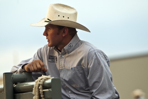 Chris Detrick  |  The Salt Lake Tribune
Tag Elliott, of Thatcher, watches the bull riding competition during the Dinosaur Roundup Rodeo Friday July 13, 2012. Tag Elliott was ranked 24th in the world when he was injured while attempting to ride a bull named Werewolf at the 2007 Days of '47 rodeo.