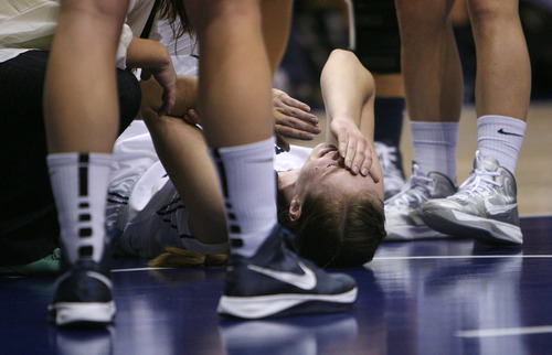 Steve Griffin | The Salt Lake Tribune


BYU's Lexi Eaton puts her hand to her face as she grimaces in pain after landing on her leg during game against BYU at the Marriott Center in Provo, Utah Tuesday December 4, 2012.