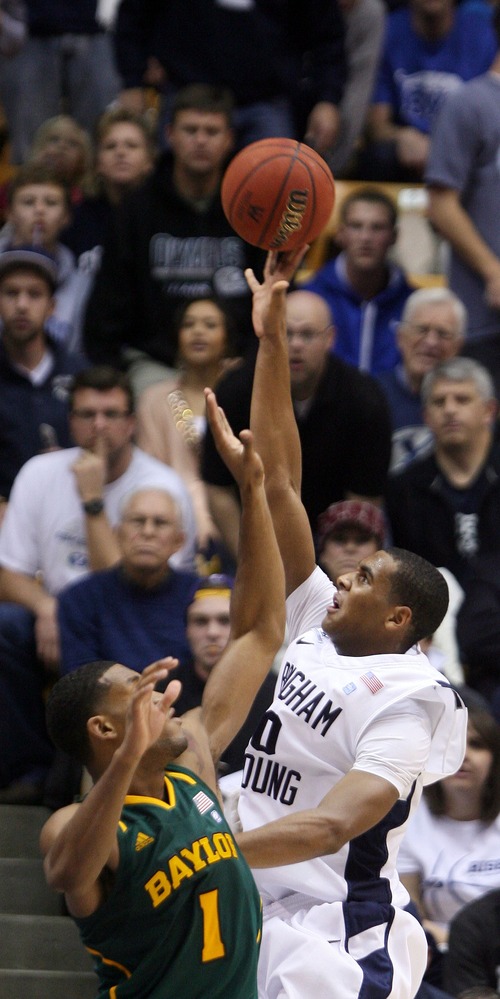 Steve Griffin  |  The Salt Lake Tribune

BYU's Brandon Davies shoots over Baylor's Perry Jones III during second half action of the BYU Baylor basketball game  in Provo, Utah Saturday, December 17, 2011.