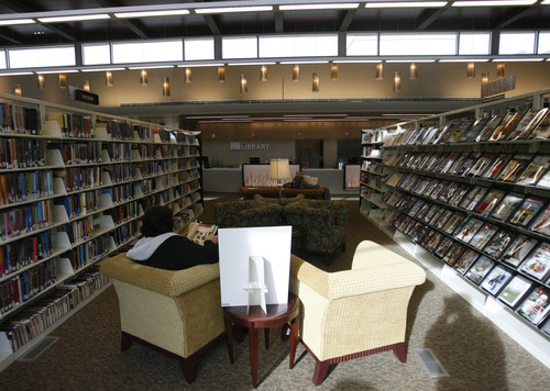 Rick Egan  | The Salt Lake Tribune 

A reader sits in one of the nooks at the new Davis County Headquarters Library.