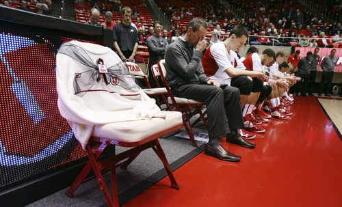 Utah assistant coach Tommy Conner wipes his eyes during a moment of silence in honor of former head coach Rick Majerus, who died Saturday, Dec. 1, 2012, before an NCAA college basketball game between Utah and Boise State, Wednesday, Dec. 5, in Salt Lake City. Numerous video tributes and a patch on Utah uniforms memorialized Majerus. The coaching staff all wore sweaters in the memory of Majerus and they placed an empty chair courtside draped with one of his actual trademark cream sweaters. Utah won 76-55. (AP Photo/The Salt Lake Tribune, Steve Griffin)  DESERET NEWS OUT; LOCAL TV OUT; MAGS OUT