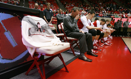 Steve Griffin | The Salt Lake Tribune
An emotional Utah assistant coach, Tommy Connor, wipes his eyes during a moment of silence in honor of former head coach Rick Majerus, who passed away Dec. 1, 2012. A white University of Utah sweater, a  Majerus trademark, is draped over a chair with a black ribbon on the University of Utah's bench, in honor of the former head coach. He was remembered during a short ceremony before the start of the Utah game against Boise State at the Huntsman Center in Salt Lake City on Wednesday, Dec. 5, 2012.  Connor was an assistant coach under Majerus.