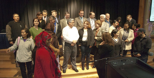 Steve Griffin | The Salt Lake Tribune


ESL students stand with members of the West Valley City council as they are honored by the city during the West Valley City council meeting at the Utah Cultural Celebration Center in West Valley City, Utah Tuesday November 20, 2012. The meeting was moved to the center to accommodate the big group.