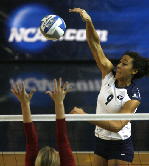 Rick Egan  | The Salt Lake Tribune 

Alexa Gray (9) spikes the ball as BYU faced Oklahoma in women's NCAA volleyball action at the Smith Fieldhouse in Provo, Saturday, December 1, 2012.