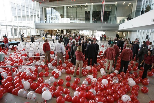 Paul Fraughton  |  The Salt Lake Tribune
Employees and guests linger among balloons that helped celebrate the official opening of the new Adobe Systems building on Friday in Lehi.
