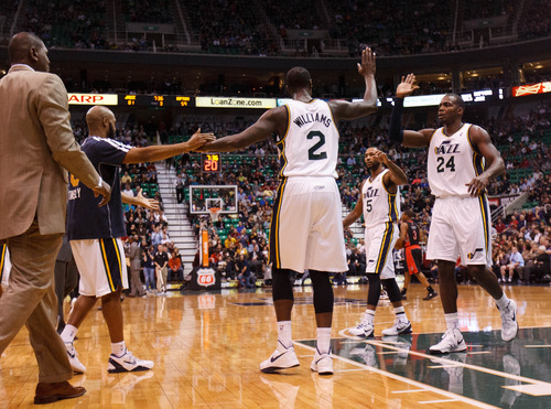 Trent Nelson  |  The Salt Lake Tribune
Utah Jazz power forward Marvin Williams (2) high-fives teammates after hitting a three-pointer to give the Jazz an 81-59 point lead as the Utah Jazz face the Toronto Raptors Friday December 7, 2012.