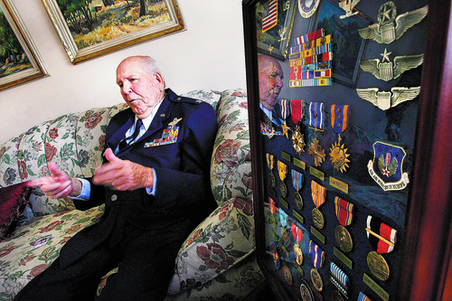 Scott Sommerdorf  |  The Salt Lake Tribune              
Emmett "Cyclone" Davis speaks about his career in his Highland home Thursday, December 6, 2012, next to a frame of the medals he has collected during his career as a pilot. Davis, a native of Roosevelt, was a young pilot in the Army Air Corps, based at Wheeler Field in Hawaii, when the Japanese attacked Pearl Harbor on Dec. 7, 1941. He was one of the few pilots able to get into the air in an attempt to defend Pearl Harbor.