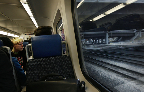 Scott Sommerdorf  |  The Salt Lake Tribune              
Riders aboard the FrontRunner train watch the view through the windows from the elevated car as it speeds through Murray on it's way to Provo, Saturday, December 8, 2012. The public was invited to ride the new FrontRunner line linking Provo and Salt Lake City starting at 10 a.m.