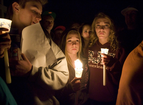 Kim Raff  |  The Salt Lake Tribune

Students mourn during a vigil for a 14-year-old boy who committed suicide on a pedestrian bridge near Bennion Junior High School in Taylorsville on Nov. 29, 2012.