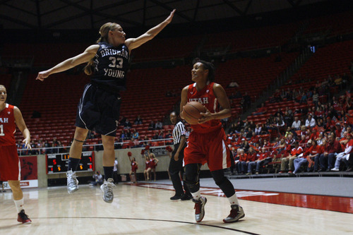 Chris Detrick  |  The Salt Lake Tribune
Brigham Young Cougars guard Haley Steed (33) guards Utah Utes guard Ciera Dunbar (31) during the first half of the game at the Huntsman Center Saturday December 8, 2012. BYU is winning the game 28-21 at halftime.