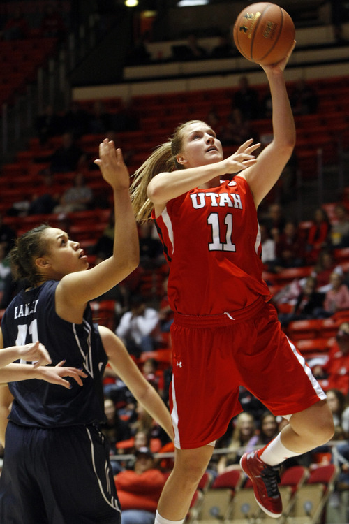 Chris Detrick  |  The Salt Lake Tribune
Utah Utes forward Taryn Wicijowski (11) shoots past Brigham Young Cougars forward Morgan Bailey (41) during the first half of the game at the Huntsman Center Saturday December 8, 2012. BYU is winning the game 28-21 at halftime.