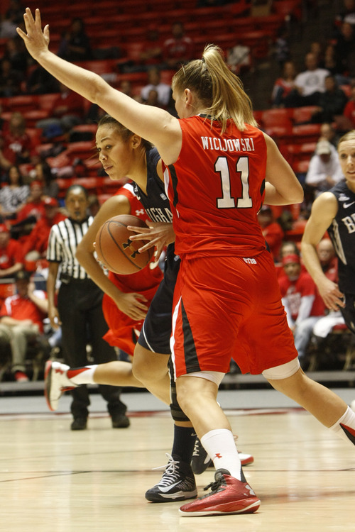 Chris Detrick  |  The Salt Lake Tribune
Brigham Young Cougars forward Morgan Bailey (41) is guarded by Utah Utes forward Taryn Wicijowski (11) during the second half of the game at the Huntsman Center Saturday December 8, 2012. BYU won the game 53-48.