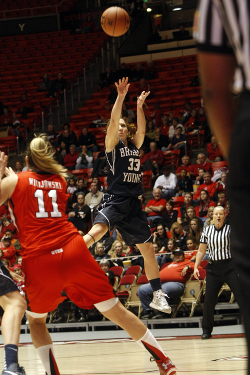 Chris Detrick  |  The Salt Lake Tribune
Brigham Young Cougars guard Haley Steed (33) shoots past Utah Utes forward Taryn Wicijowski (11) during the second half of the game at the Huntsman Center Saturday December 8, 2012. BYU won the game 53-48.
