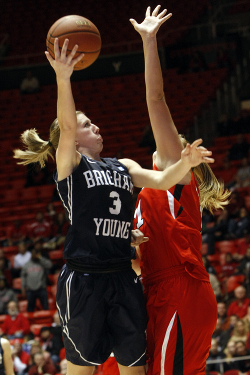 Chris Detrick  |  The Salt Lake Tribune
Brigham Young Cougars guard Ashley Garfield (3) shoots past Utah Utes forward Taryn Wicijowski (11) during the second half of the game at the Huntsman Center Saturday December 8, 2012. BYU won the game 53-48.