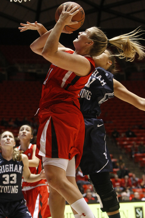 Chris Detrick  |  The Salt Lake Tribune
Utah Utes forward Taryn Wicijowski (11) shoots past Brigham Young Cougars forward Morgan Bailey (41) during the first half of the game at the Huntsman Center Saturday December 8, 2012. BYU is winning the game 28-21 at halftime.
