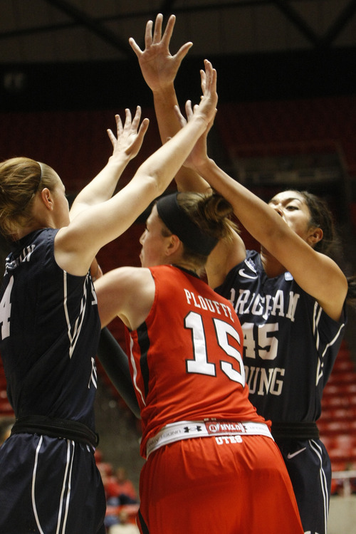 Chris Detrick  |  The Salt Lake Tribune
Brigham Young Cougars guard Kim Parker Beeston (4) and Brigham Young Cougars forward Keilani Unga (45) guard Utah Utes forward Michelle Plouffe (15) during the first half of the game at the Huntsman Center Saturday December 8, 2012. BYU is winning the game 28-21 at halftime.