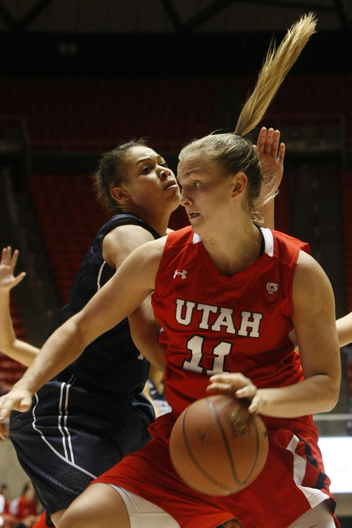 Chris Detrick  |  The Salt Lake Tribune
Utah Utes forward Taryn Wicijowski (11) runs around Brigham Young Cougars forward Morgan Bailey (41) during the first half of the game at the Huntsman Center Saturday December 8, 2012. BYU is winning the game 28-21 at halftime.