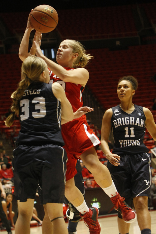 Chris Detrick  |  The Salt Lake Tribune
Utah Utes guard Rachel Messer (13) shoots past Brigham Young Cougars guard Haley Steed (33) during the first half of the game at the Huntsman Center Saturday December 8, 2012. BYU is winning the game 28-21 at halftime.
