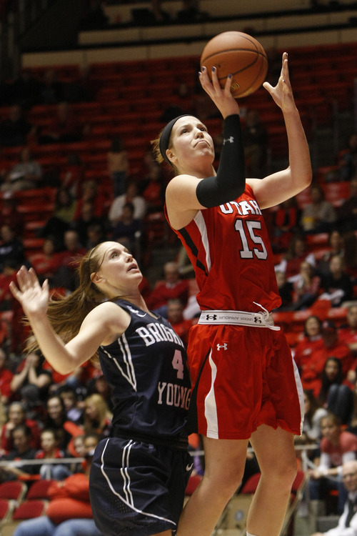 Chris Detrick  |  The Salt Lake Tribune
Utah Utes forward Michelle Plouffe (15) shoots past Brigham Young Cougars guard Kim Parker Beeston (4) during the first half of the game at the Huntsman Center Saturday December 8, 2012. BYU is winning the game 28-21 at halftime.