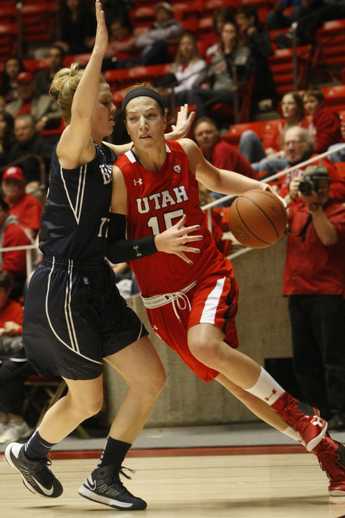 Chris Detrick  |  The Salt Lake Tribune
Utah Utes forward Michelle Plouffe (15) runs around Brigham Young Cougars guard/forward Stephanie Vermunt Seaborn (12) during the first half of the game at the Huntsman Center Saturday December 8, 2012. BYU is winning the game 28-21 at halftime.