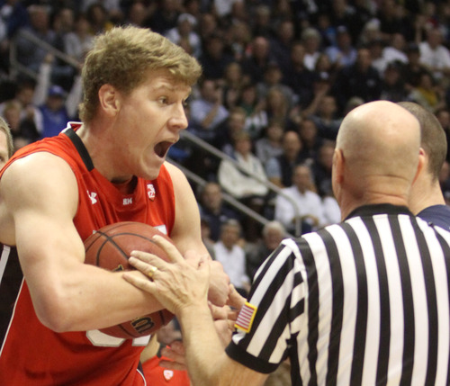 Rick Egan  | The Salt Lake Tribune 

Utah Utes center Dallin Bachynski (31)  reacts to the whistle, in basketball action between the Brigham Young Cougars and the Utah Utes at the Marriott Center in Provo, Saturday, December 8, 2012.