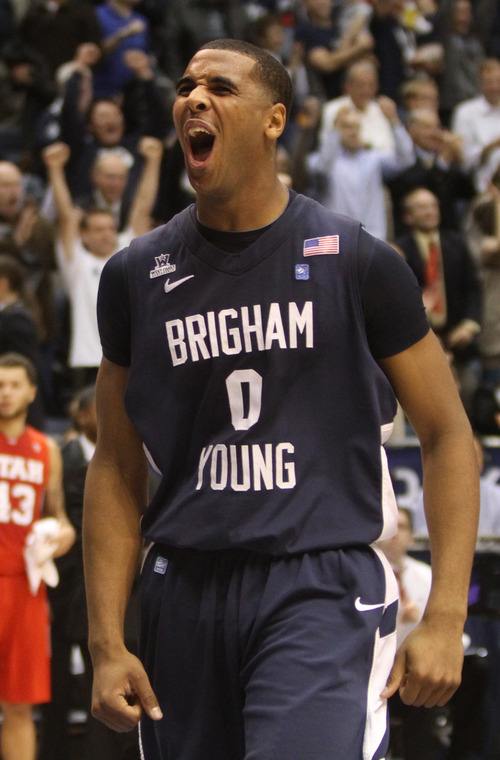 Rick Egan  | The Salt Lake Tribune 

Brigham Young Cougars forward Brandon Davies (0) cheers as at the buzzer as BYU defeats Utah 61-58, in basketball action between the Brigham Young Cougars and the Utah Utes at the Marriott Center in Provo, Saturday, December 8, 2012.