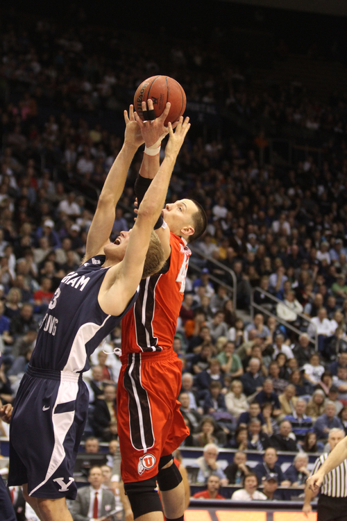 Rick Egan  | The Salt Lake Tribune 

Brigham Young Cougars guard Tyler Haws (3) goes for a rebound along with Utah Utes center Jason Washburn (42) in basketball action between the Brigham Young Cougars and the Utah Utes at the Marriott Center in Provo, Saturday, December 8, 2012.