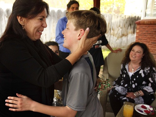 Leah Hogsten  |  The Salt Lake Tribune
Mirta López greets Allyson Gamble's son Ben, 11, during the two families' first meeting last April at Gamble's Salt Lake City home. 
The family from Paraguay feels a special bond with the Gambles after 25-year-old Gabriela Caballero was killed in an accident last December and her heart transplanted into Allyson Gamble, saving her life.