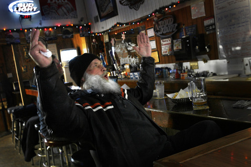 Scott Sommerdorf  |  The Salt Lake Tribune              
Gary Clark lets out a yell as the Cowboys kick a field goal to win their game against the Bengals Sunday, December 9, 2012. Sofa's Bar in Garland, Utah, began selling beer on Sunday and will continue to sell on Sundays through Super Bowl Sunday on Feb. 13.