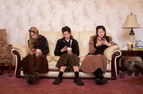 Trent Nelson  |  The Salt Lake Tribune
Allie Steed, Helen Holm and Heidi Holm look at their phones Saturday, Dec. 1, 2012 in Colorado City. The three young women recently left the FLDS church.