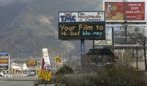 Rick Egan  | The Salt Lake Tribune
Salt Lake County has passed an ordinance regulating electronic messaging signs, limiting how often they can change and how much animation is allowed. Several electronic messaging signs are seen on 3300 South at about 2900 East.