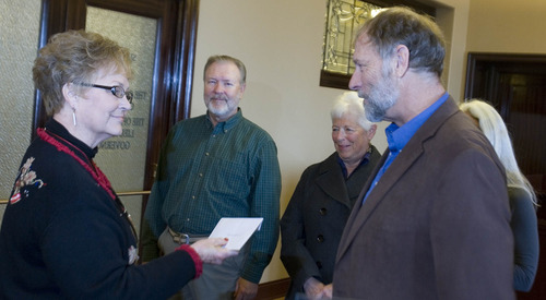 Paul Fraughton  |  The Salt Lake Tribune
Steve Erickson, of The Great Basin Water Network, right, with Kirk Robinson, executive director of the Western Wildlife Conservancy; Linda Johnson, of The Salt Lake League of Women Voters; and Lynn de Freitas, of the Friends of Great Salt Lake, hand a letter to Fran Fish of Gov. Gary Herbert's office urging him not to sign the proposed agreement with Nevada dealing with water in Utah's Snake Valley.
 Tuesday, December 11, 2012