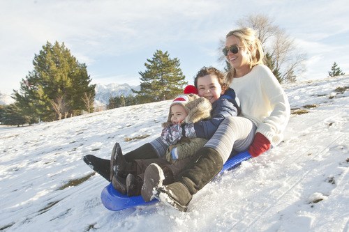 Chris Detrick  |  The Salt Lake Tribune
Maddi Jenson, Marcus Jenson, 5, and Astrid Jenson, 16 months, sled at Sugar House Park Tuesday December 11, 2012.