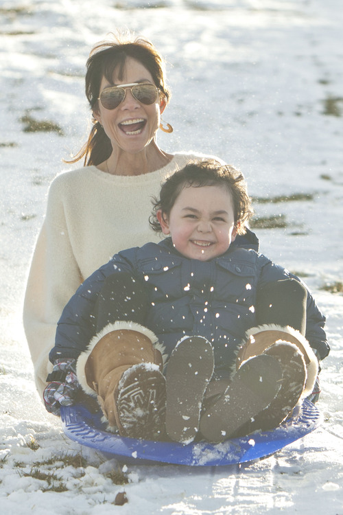 Chris Detrick  |  The Salt Lake Tribune
Stori Jenson and her grandson Marcus Jenson, 5, sled at Sugar House Park Tuesday December 11, 2012.
