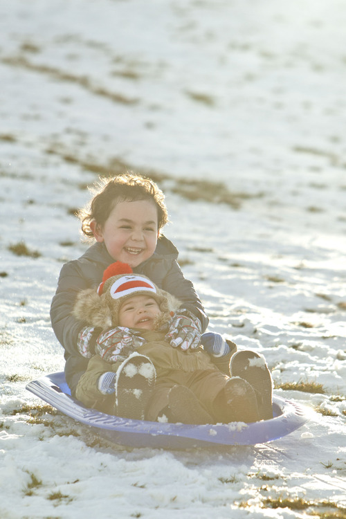 Chris Detrick  |  The Salt Lake Tribune
Marcus Jenson, 5, and his sister Astrid Jenson, 16 months, sled at Sugar House Park Tuesday December 11, 2012.