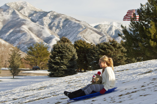 Chris Detrick  |  The Salt Lake Tribune
Maddi Jenson and Astrid Jenson, 16 months, sled at Sugar House Park Tuesday December 11, 2012.