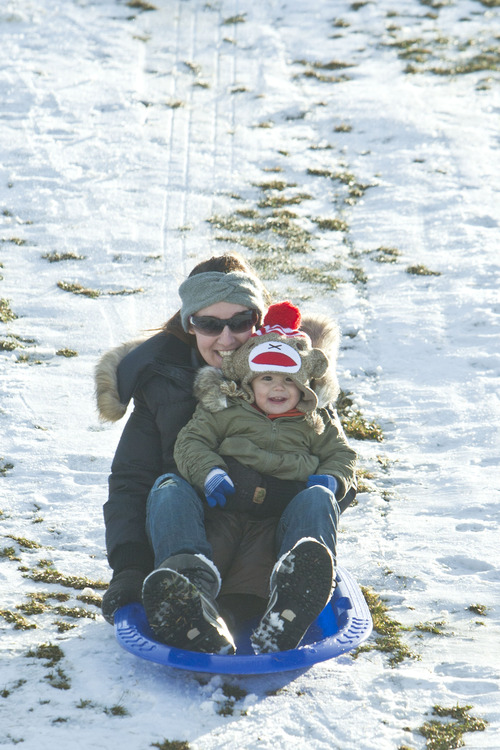 Chris Detrick  |  The Salt Lake Tribune
Melanie Jenson and Astrid Jenson, 16 months, of Sugar House, sled at Sugar House Park Tuesday December 11, 2012.