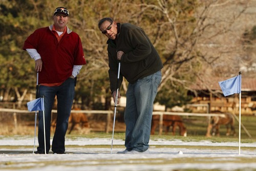 Leah Hogsten  |  The Salt Lake Tribune
l-r Dave Williams and Mark Smedley of Kaysville sink some practice putts Tuesday December 11, 2012 in Kaysville at Davis Park Golf Course. No matter what the weather is like, the two can be seen on the putting green nearly every day, snow or no snow.