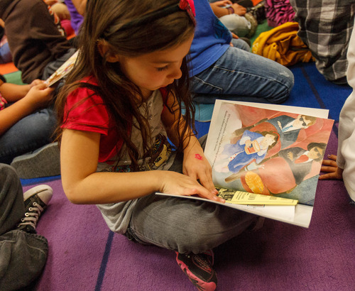 Trent Nelson  |  The Salt Lake Tribune
Stansbury Elementary first-grader Shayla reads from a book she received as part of the Utah State Bar's "Books from Barristers" program Tuesday, Dec. 11, 2012 in West Valley City.