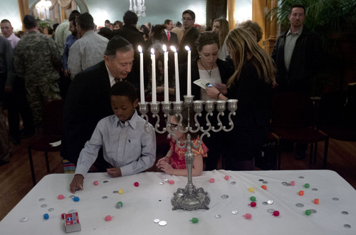 Steve Griffin | The Salt Lake Tribune
Candles burn during menorah lighting ceremony at the Governor's Mansion in Salt Lake City, Utah Tuesday December 11, 2012. The Hanukkah celebration was attended by dignitaries, local families, and community leaders. Rabbi Benny Zippel emphasized the importance of the state celebrating the constitutional "freedom of religion," not a "freedom from religion."