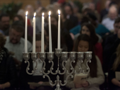 Steve Griffin | The Salt Lake Tribune
Candles burn during menorah lighting ceremony at the Governor's Mansion in Salt Lake City on Tuesday, Dec. 11, 2012. The Hanukkah celebration was attended by dignitaries, local families and community leaders.