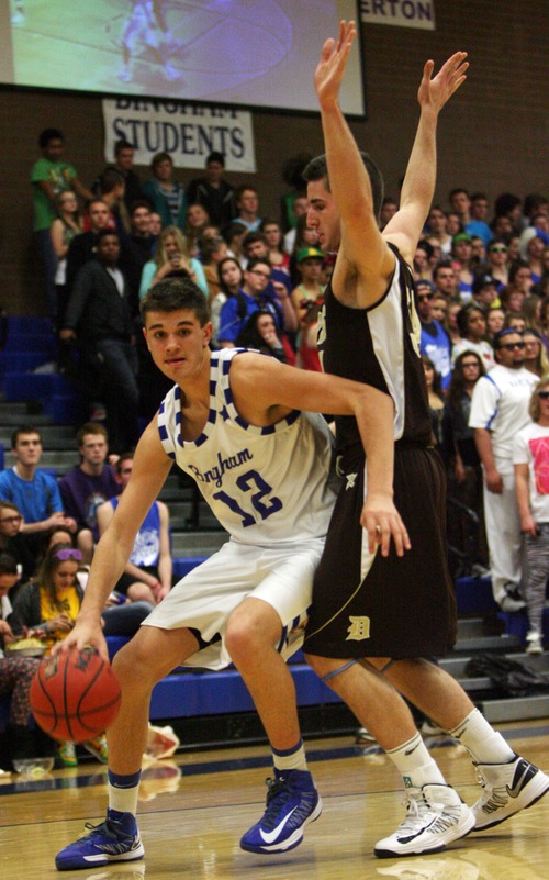 Kim Raff  |  The Salt Lake Tribune
Davis player (right) Cole Hally defends as Bingham player Brandon Morley drives the basket during a game at Bingham High School in South Jordan on December 7, 2012. Davis went on to win the game.