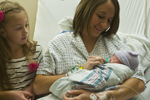 Chris Detrick  |  The Salt Lake Tribune
Natalie Whitney holds her new baby girl at St. Mark's Hospital Wednesday December 12, 2012.  The baby was born at 12:12:12 p.m. on 12/12/12. At left is her daughter Ella, 8.
