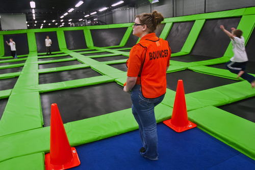 Chris Detrick  |  The Salt Lake Tribune
Bouncer Brianna Ekker watches over the guests at the Wairhouse Trampoline Park Tuesday December 4, 2012. The Wairhouse has 15,000 square feet of trampoline area including two full size dodge ball courts, four slam dunk basketball lanes, foam pit and an open jump court.