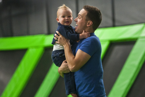 Chris Detrick  |  The Salt Lake Tribune
Mike Curtis and his son Chandler, 18 months, bounce around at the Wairhouse Trampoline Park Tuesday December 4, 2012. The Wairhouse has 15,000 square feet of trampoline area including two full size dodge ball courts, four slam dunk basketball lanes, foam pit and an open jump court.