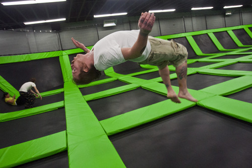 Chris Detrick  |  The Salt Lake Tribune
Taylor Orton, of Salt Lake City, does a back flip at the Wairhouse Trampoline Park Tuesday December 4, 2012. The Wairhouse has 15,000 square feet of trampoline area including two full size dodge ball courts, four slam dunk basketball lanes, foam pit and an open jump court.