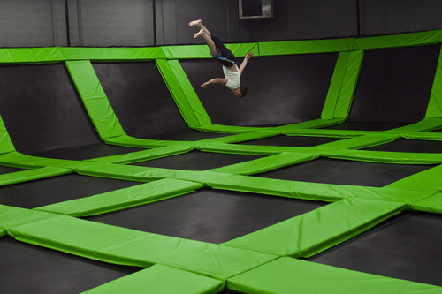 Chris Detrick  |  The Salt Lake Tribune
Walter Allred, of Salt Lake City, does a flip at the Wairhouse Trampoline Park Tuesday December 4, 2012. The Wairhouse has 15,000 square feet of trampoline area including two full size dodge ball courts, four slam dunk basketball lanes, foam pit and an open jump court.