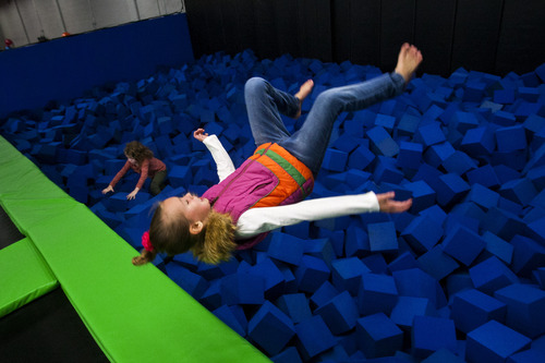 Chris Detrick  |  The Salt Lake Tribune
Hailey Curtis, 9, of South Jordan, does a flip into the foam pit at the Wairhouse Trampoline Park The Wairhouse has 15,000 square feet of trampoline area including two full size dodge ball courts, four slam dunk basketball lanes, foam pit and an open jump court.